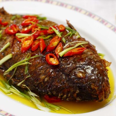 Crispy tilapia with calamansi and turmeric sauce