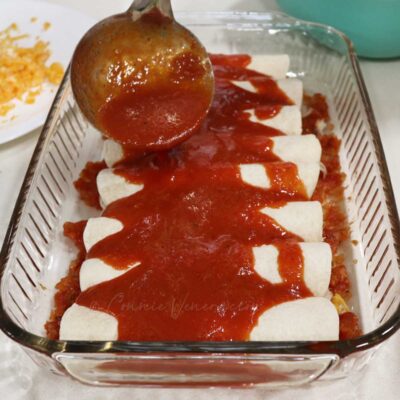 Homemade tomato sauce over enchiladas