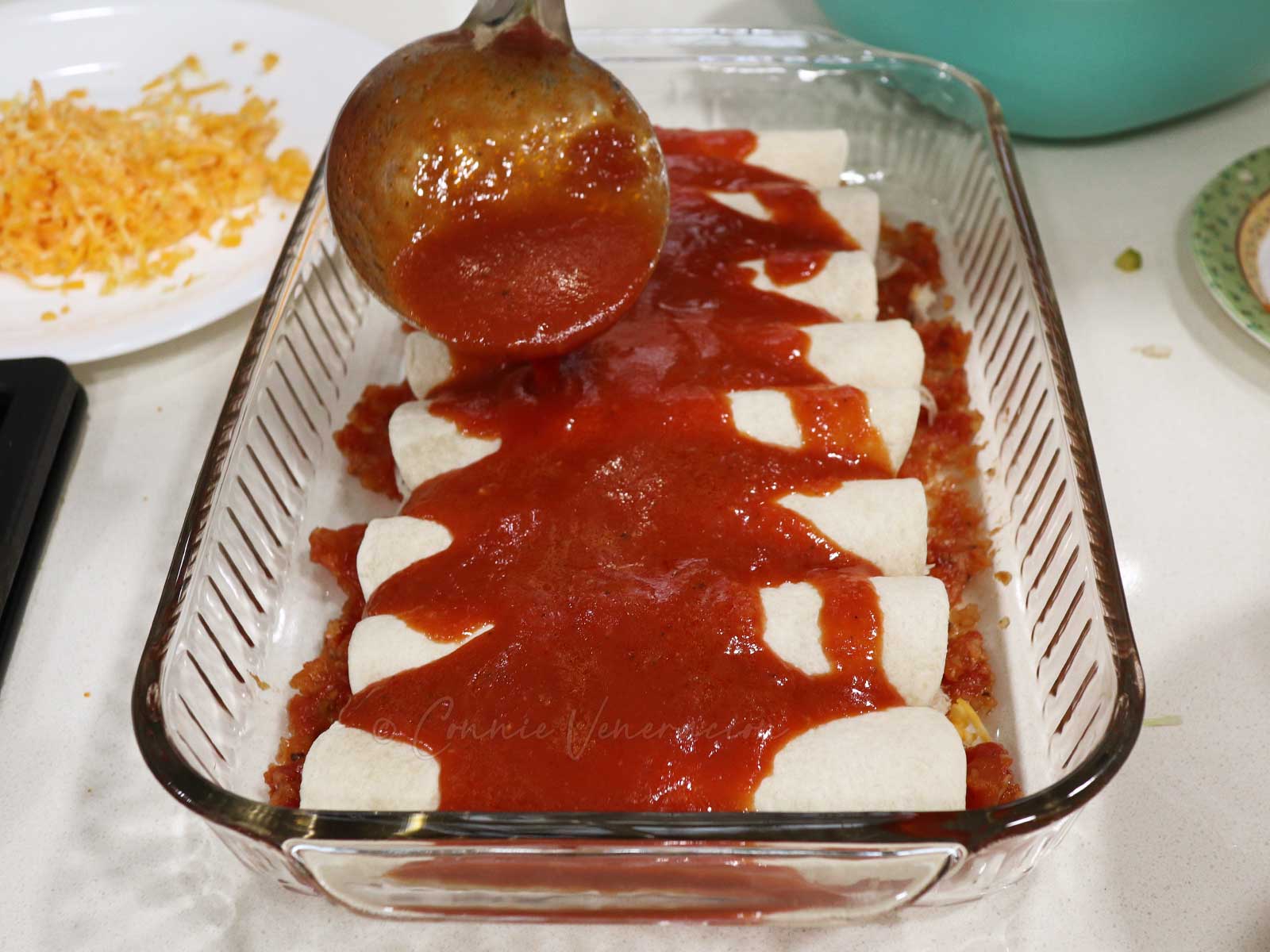 Homemade tomato sauce over enchiladas