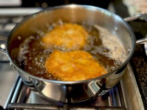 Deep frying chicken thigh fillets