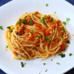 Spaghetti with sardines in brandied tomato sauce