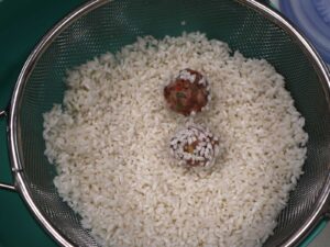 Meatballs rolled in sticky rice