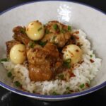 Chicken wings and quail eggs adobo