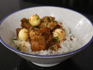 Chicken wings and quail eggs adobo