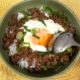 Shakshuka-style ground pork adobo and egg served over rice