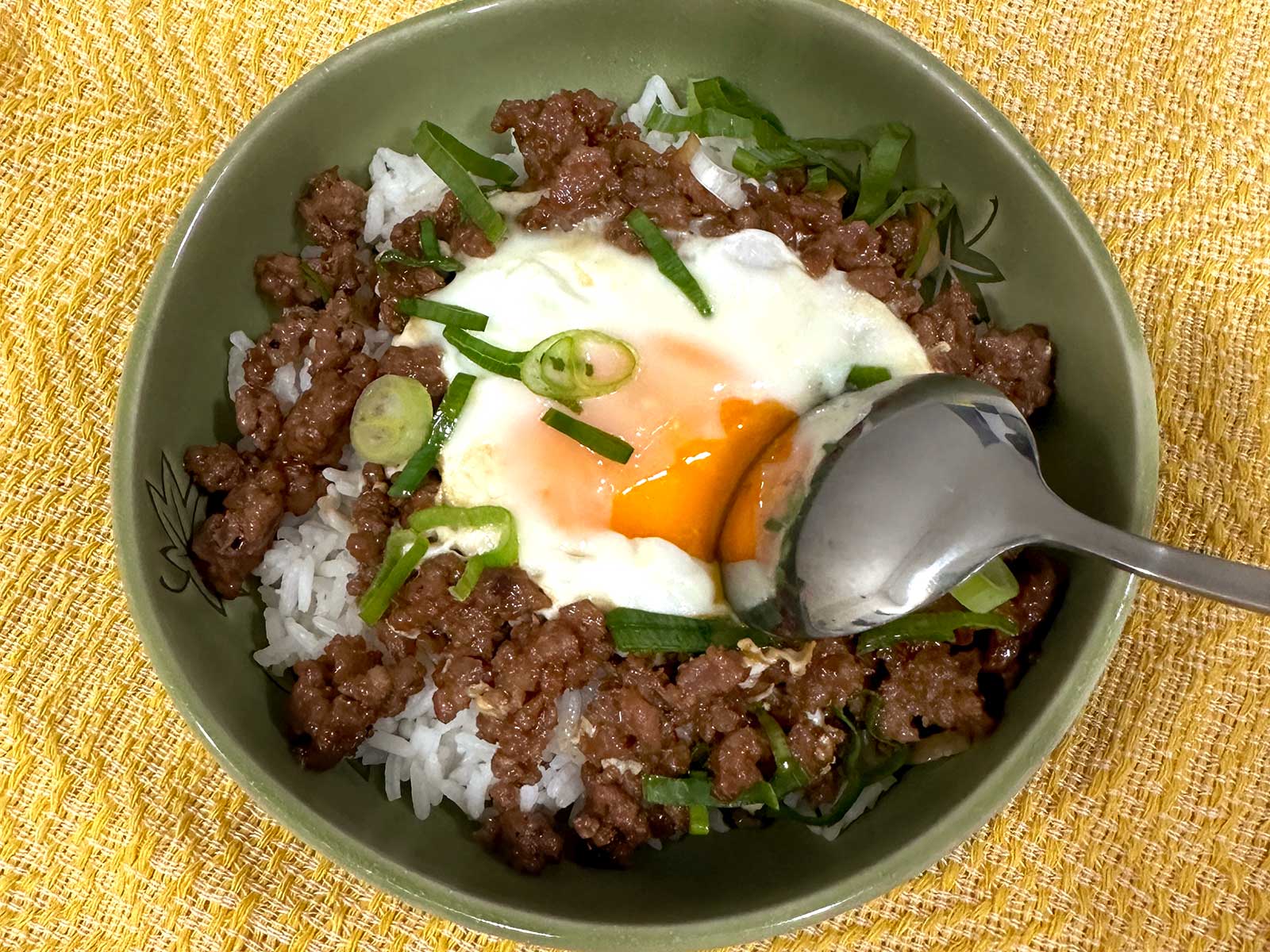 Shakshuka-style ground pork adobo and egg served over rice