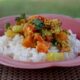 Ground pork and vegetable curry over rice