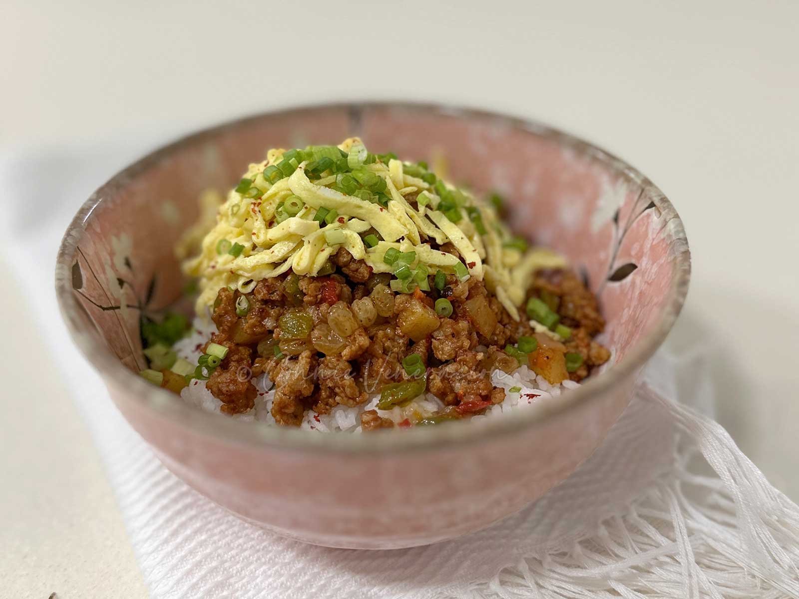 Sweet sour ground pork stew with tomatoes, chilies and sultanas