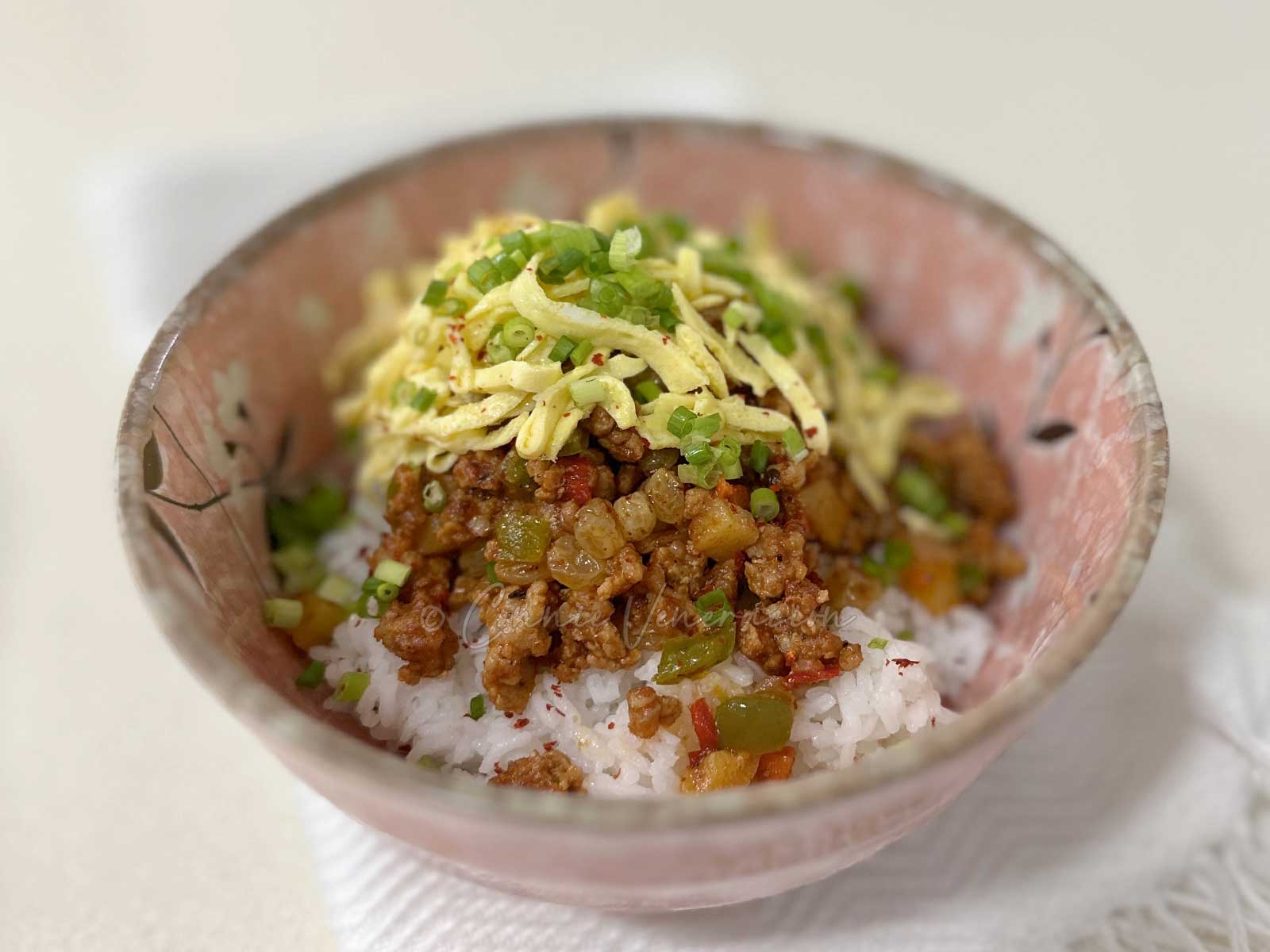 Sweet sour ground pork stew with tomatoes, chilies and sultanas