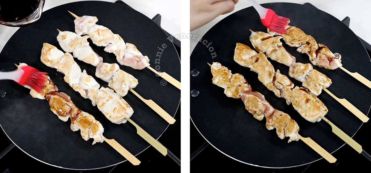 Brushing skewered chicken with sauce