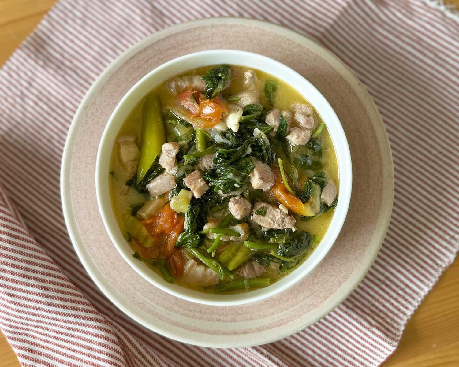 Spicy pork belly, spinach and coconut cream stew