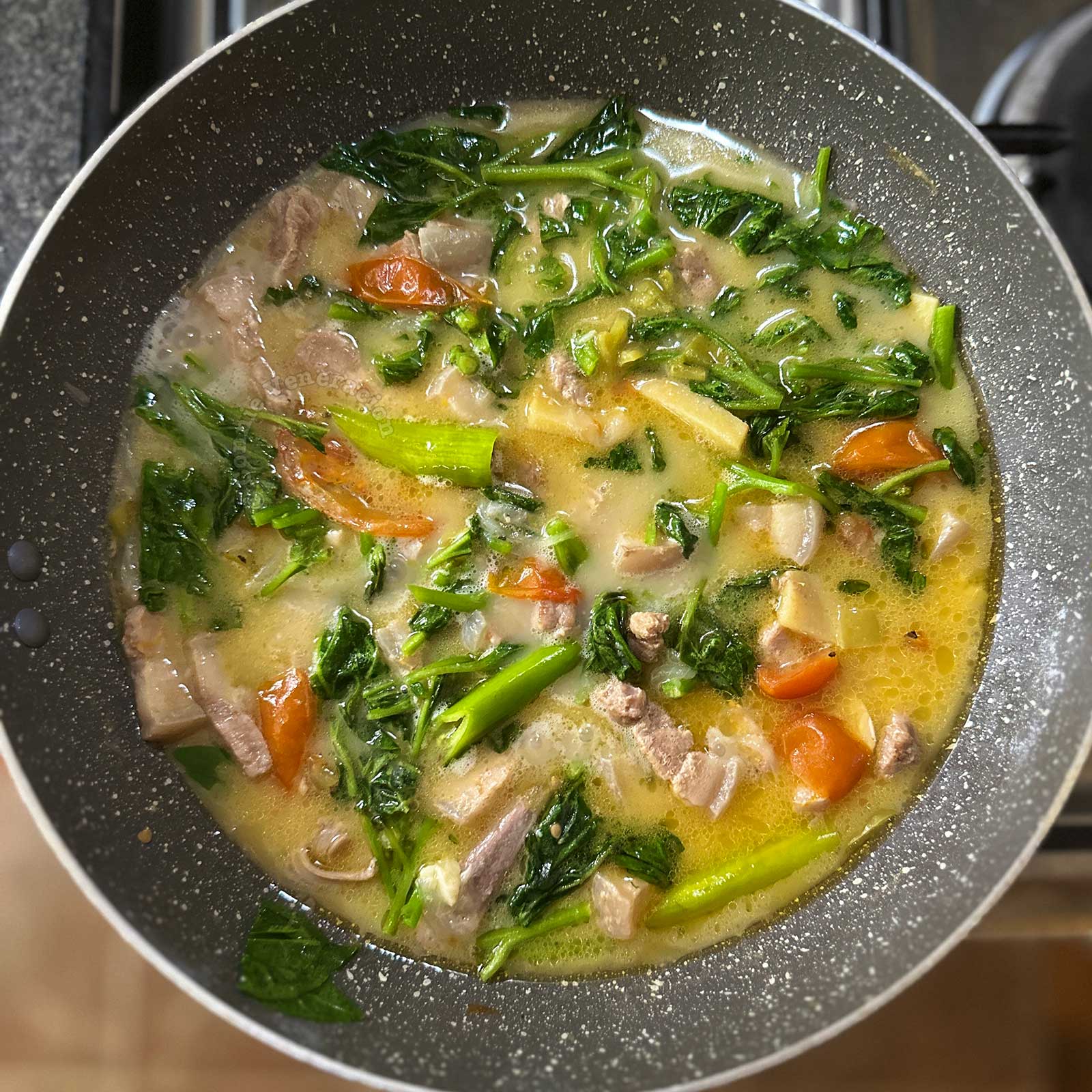 Spicy pork belly, spinach and coconut cream stew