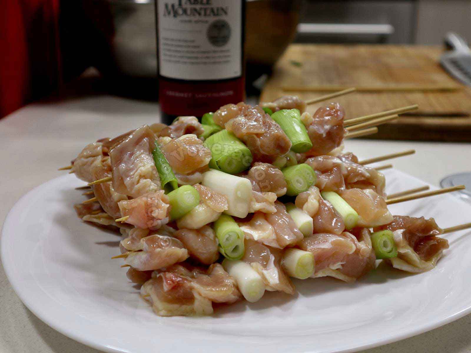 Skewered chicken and scallions
