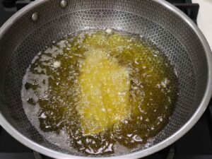 Deep frying battered fish fillet