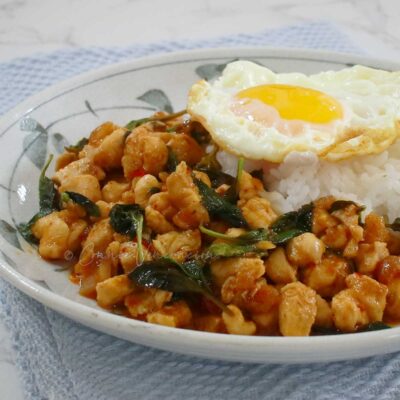 Thai basil chicken (pad kaphrao gai) served with rice and fried egg