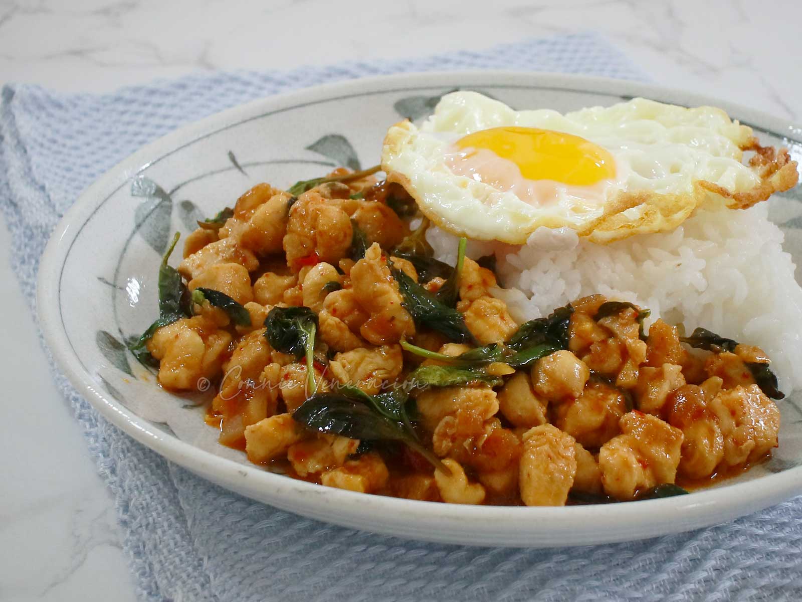 Thai basil chicken (pad kaphrao gai) served with rice and fried egg