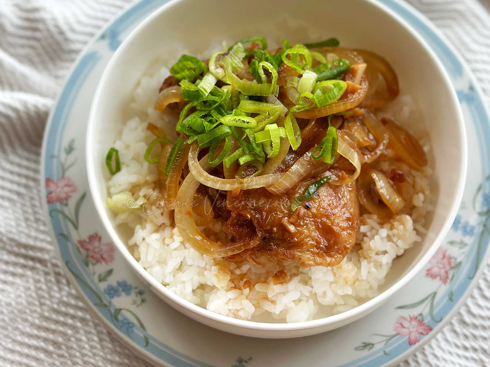 20-minute soy calamansi chicken served with onion rings and sliced scallions