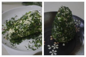 Rolling shaped cream cheese in chopped fresh herbs