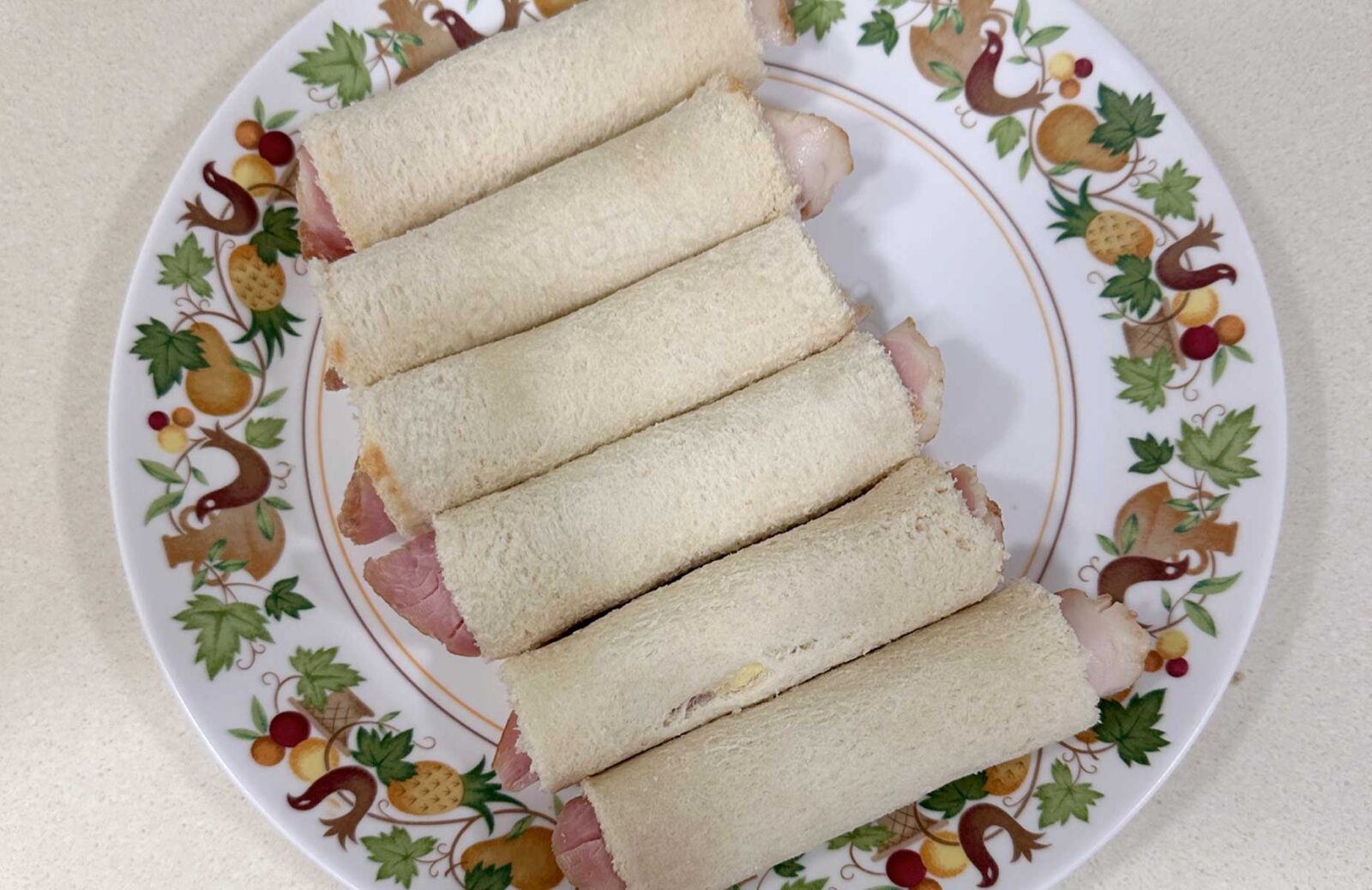 Filled and rolled flattened bread