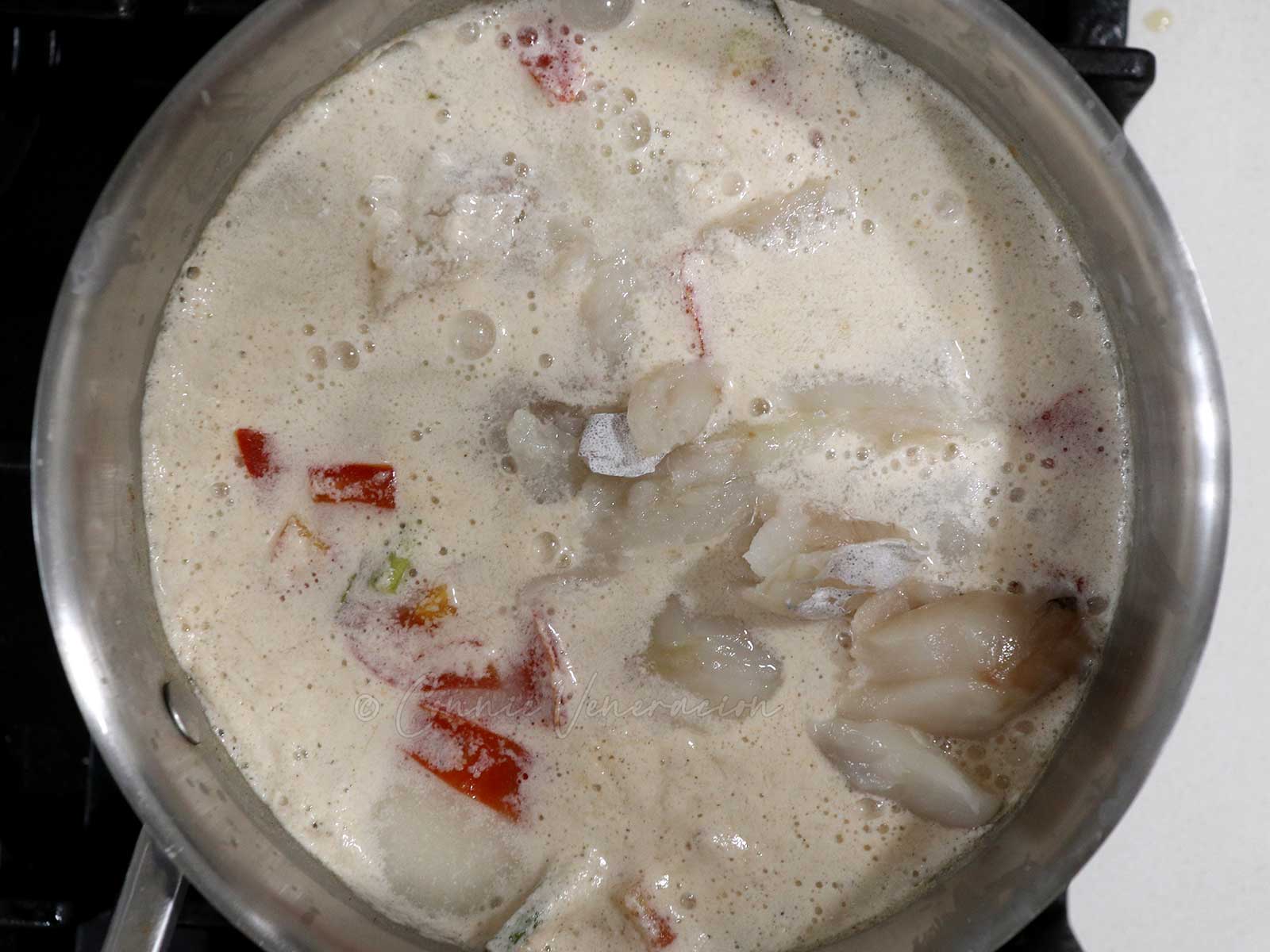 Simmering fish in coconut cream