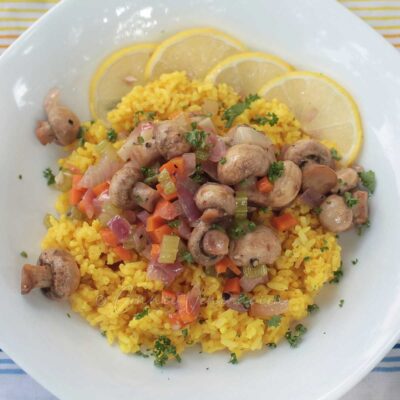 Lemon garlic mushrooms over mock saffron rice￼
