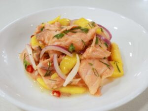 Salmon ceviche with dill, cilantro, red onion, chilies and fresh sweet mango