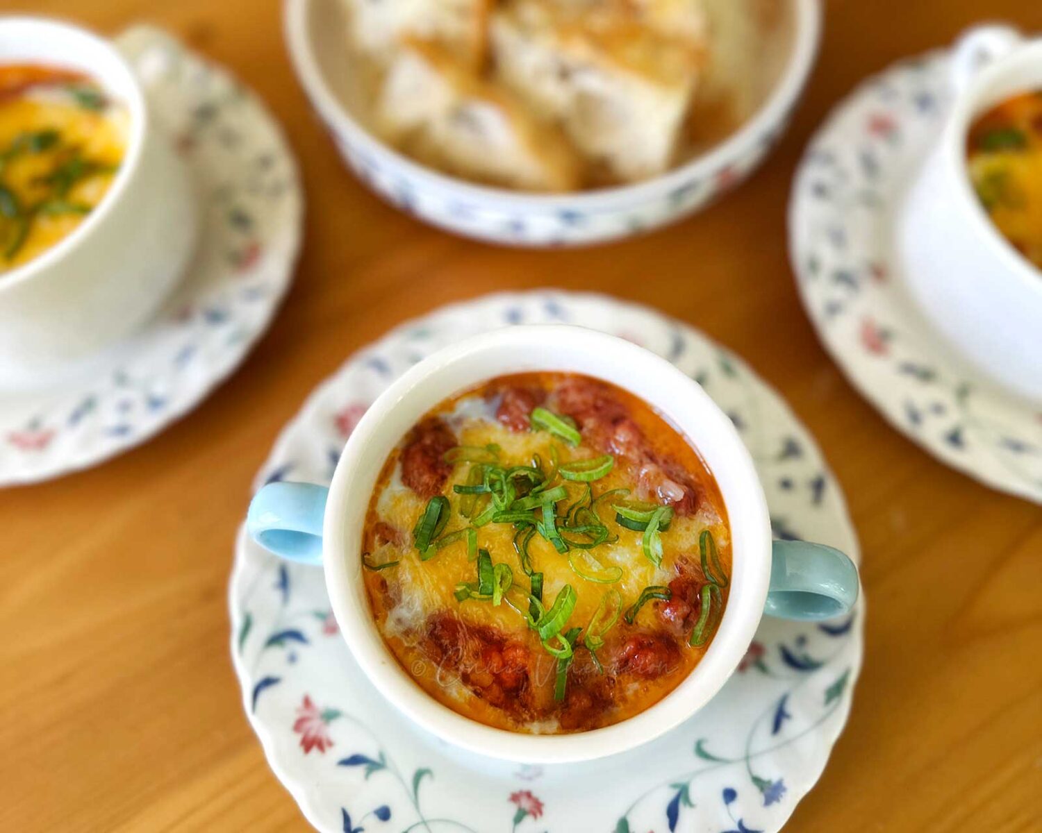 Eggs en cocotte with bacon and sausage meat ragu