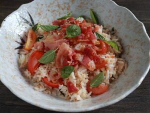 Fried rice with bacon, tomato, garlic and basil