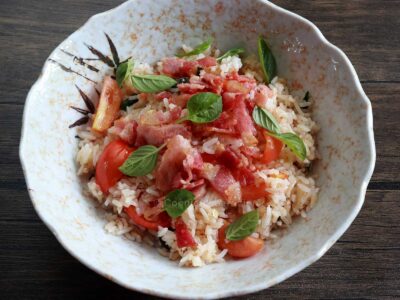 Fried rice with bacon, tomato, garlic and basil