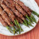 Beef and asparagus rolls with teriyaki sauce