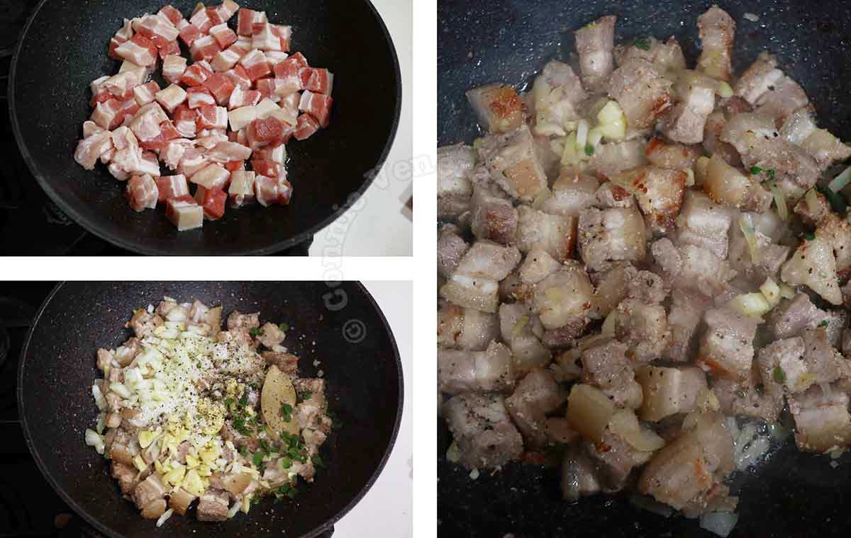 Browning pork belly cubes in pan before sauteeing with garlic, onion, oregano and bay leaf