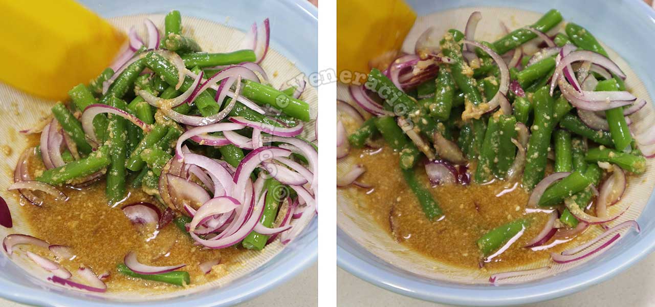 Tossing green beans and sliced red onion with sesame dressing