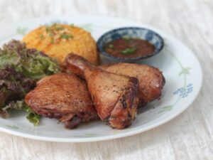 Guam-style oven-grilled chicken with annatto rice and fina'denne'