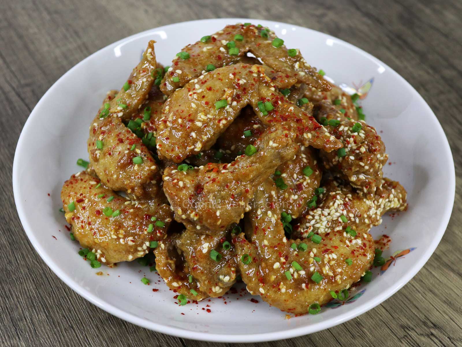 Fried chicken wings glazed with satay sauce
