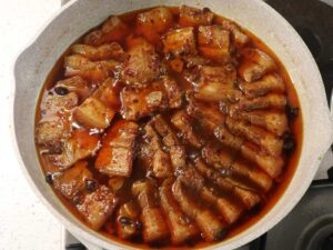 Fully cooked humba in pan