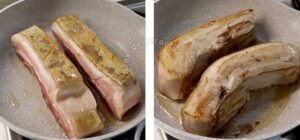 Browning slabs of pork belly in oil