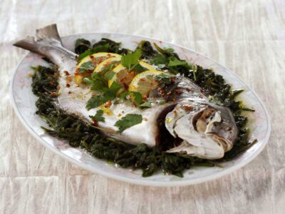 Steamed whole pompano with lemon and olive oil