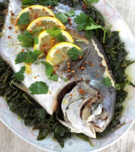 Steamed whole pompano with lemon and olive oil