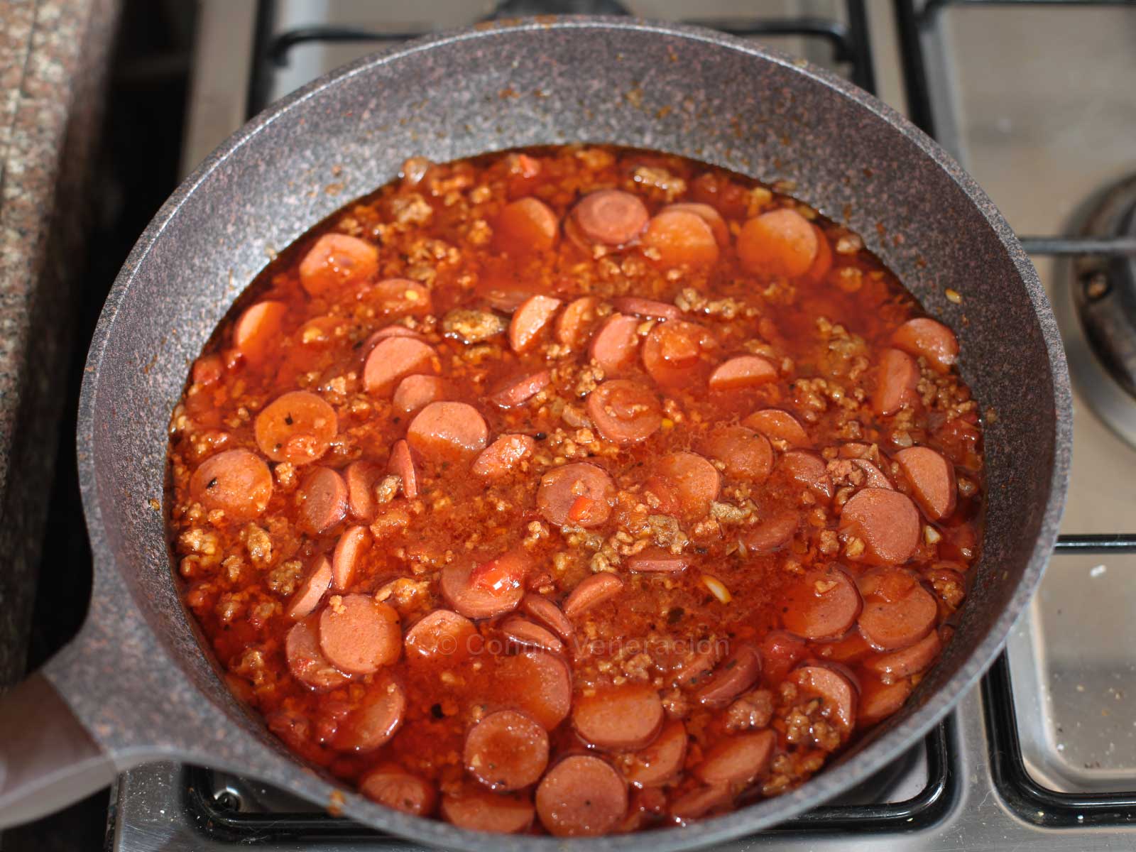 Filipino-style sweet spaghetti sauce with ground meat and hotdogs
