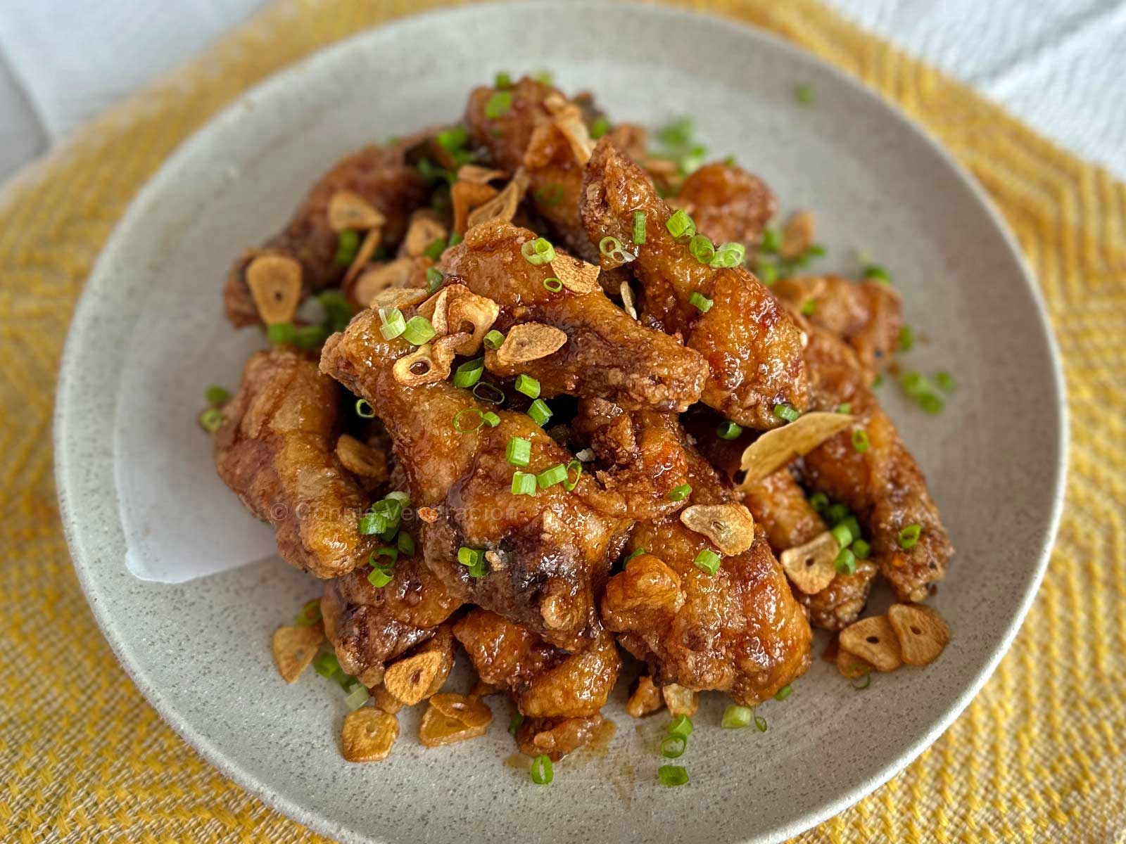 Fried chicken wings with honey adobo glaze