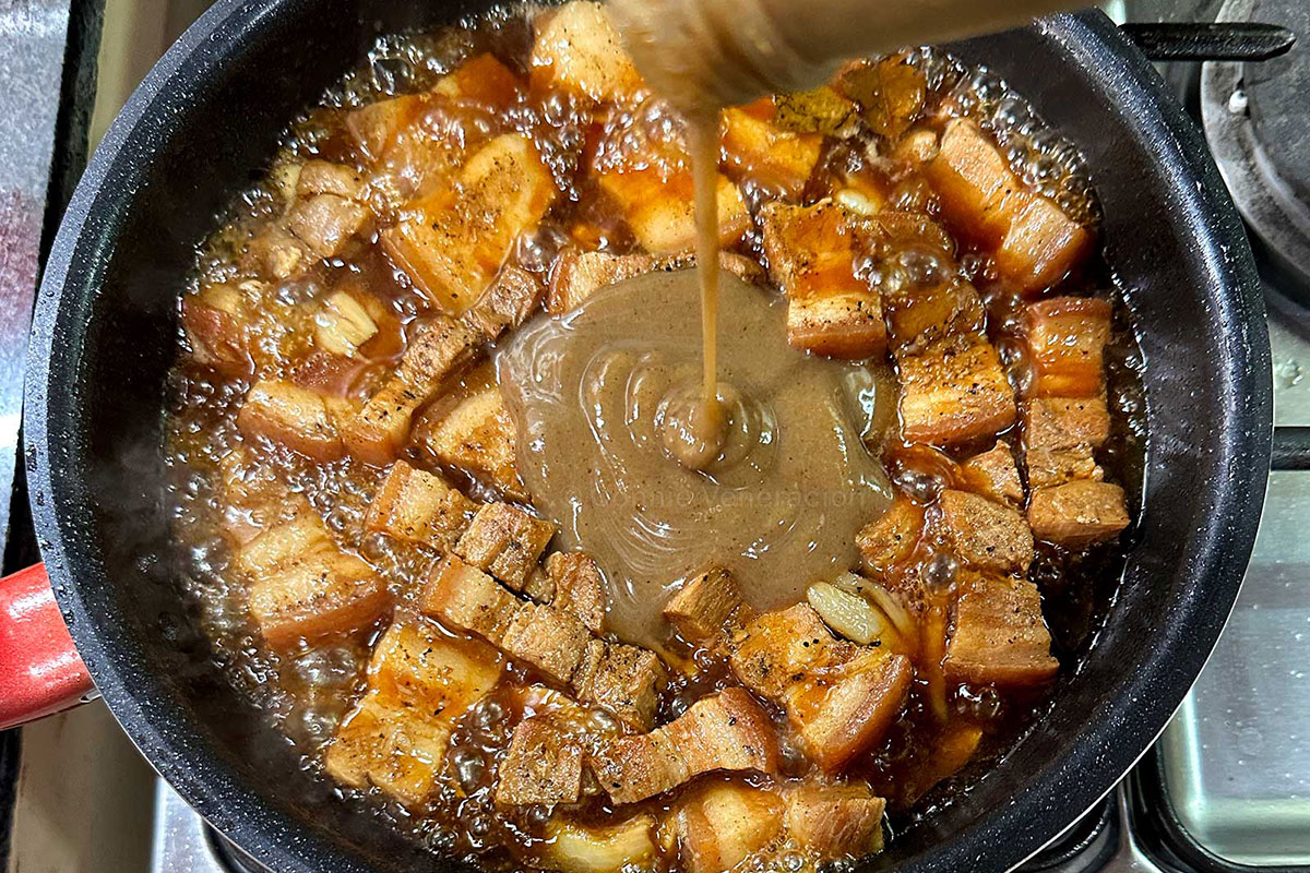 Adding lechon sauce to pork adobo