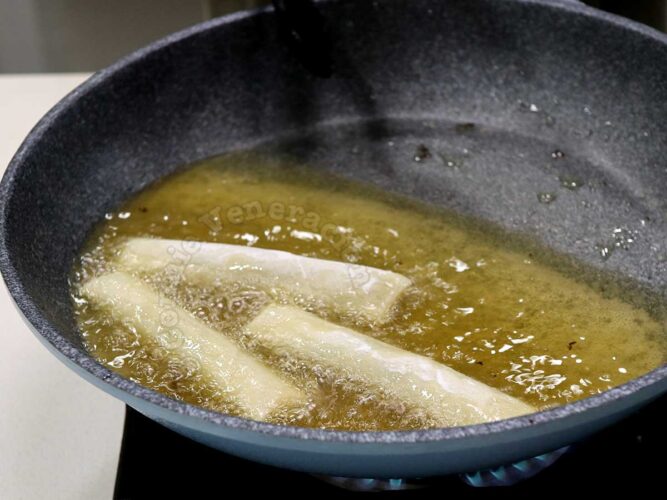 Frying s[ring rolls