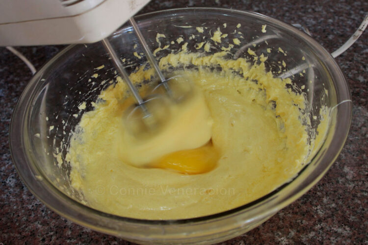 Adding eggs to creamed butter and sugar