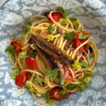 Spaghetti with gourmet tuyo, cherry tomatoes, Thai basil and mint