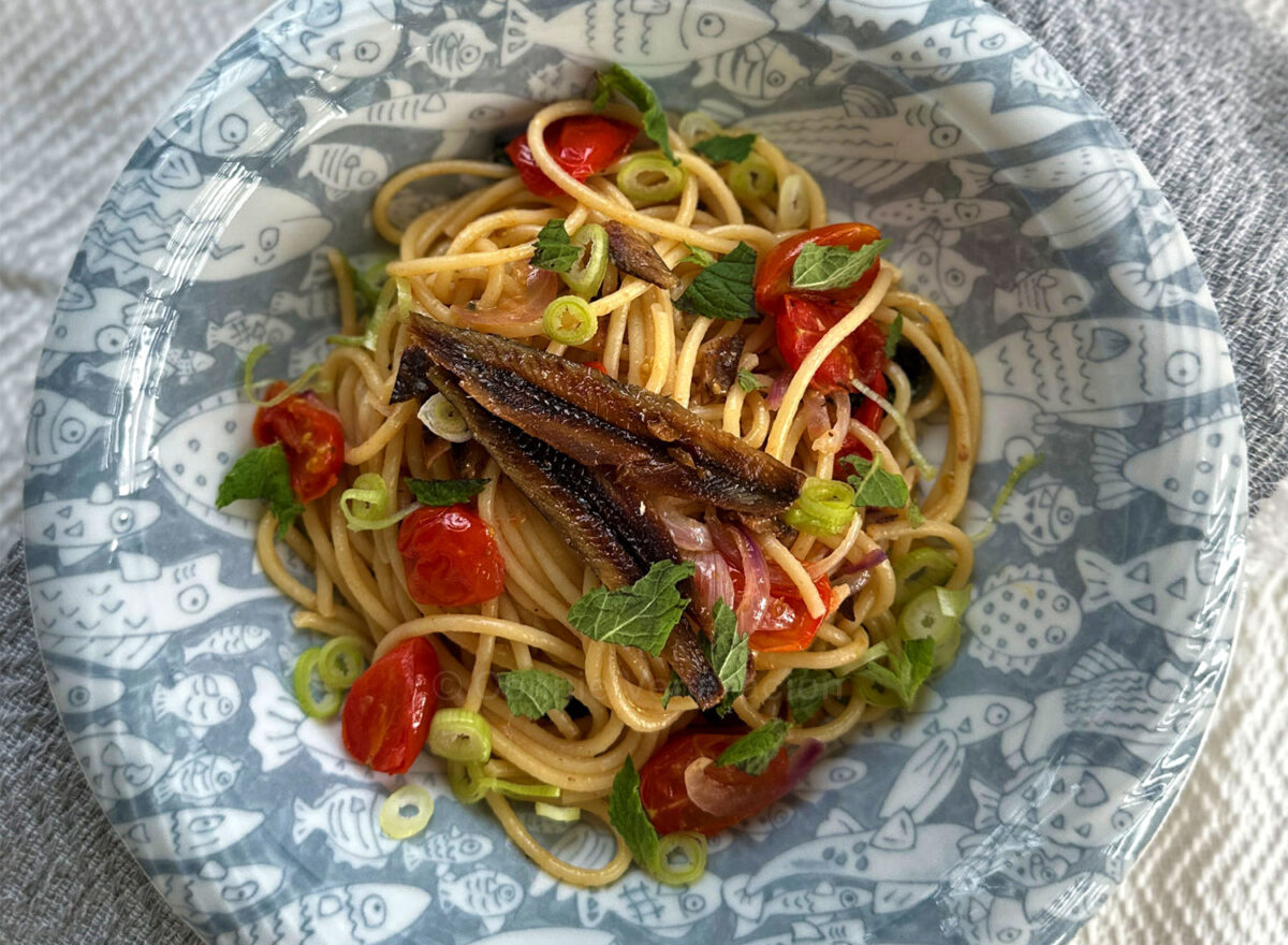 Spaghetti with gourmet tuyo, cherry tomatoes, Thai basil and mint
