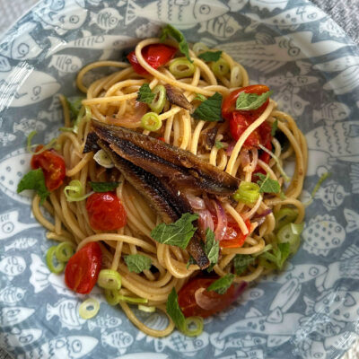 Spaghetti with gourmet tuyo, cherry tomatoes, Thai basil and mint