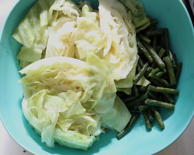 Cabbage wedges and sitaw in a bowl
