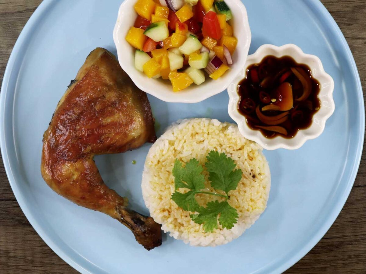 Chicken inasal with ensalada, dipping sauce and rice