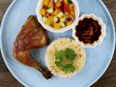 Chicken inasal with ensalada, dipping sauce and rice