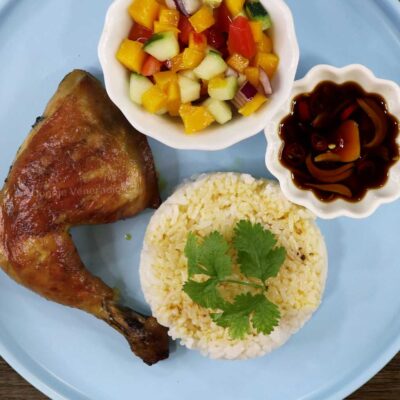 Chicken inasal with ensalada, dipping sauce and rice